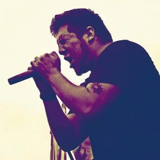 Jose Urquiza performing with microphone